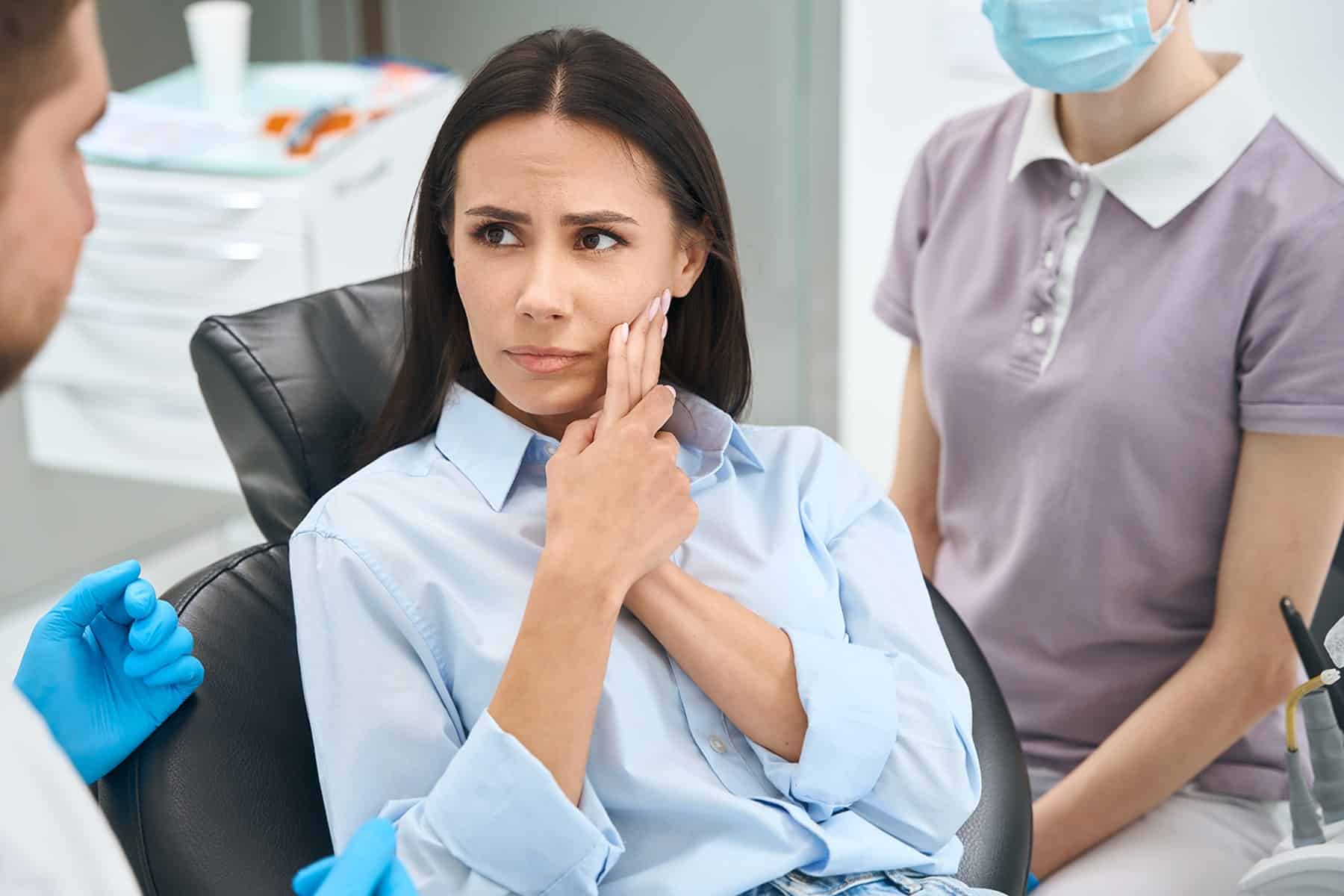 Woman in need of a root canal treatment in Savannah, GA